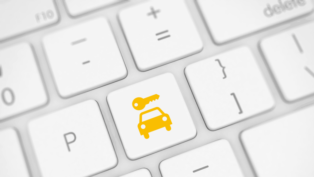 Computertaste mit Symbol für Autoschlüssel und Auto – steht für die digitale Punkteabfrage im Fahreignungsregister Flensburg.